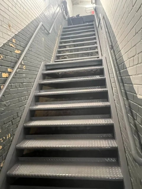 Finished custom steel staircase installed by Steel Masters NYC in Brooklyn residential property
