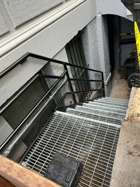 Economaster trash bin enclosure and rolldown gate installed by Steel Masters NYC in Bedford-Stuyvesant Brooklyn